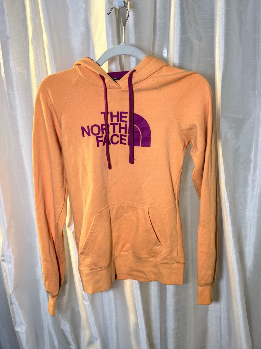 The North Face Peach Hoodie with Purple Logo